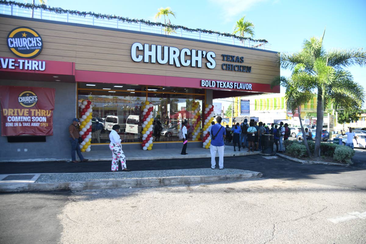 Persons mill around at the opening of the Church’s Texas Chicken fast-food eatery, at the opening of the franchise’s first store at Mall Plaza, Constant Spring Road, Kingston, on December 8, 2025.