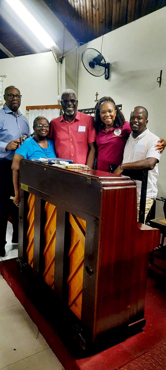 From left: Chaplain Reverend Karl Henlin, past member Grace England, guitarist Lewis Campbell, pianist Karen Henry and drummer Odean Taylor after the Portmore Chorale’s Christmas concert at the Church of the Holy Spirit.