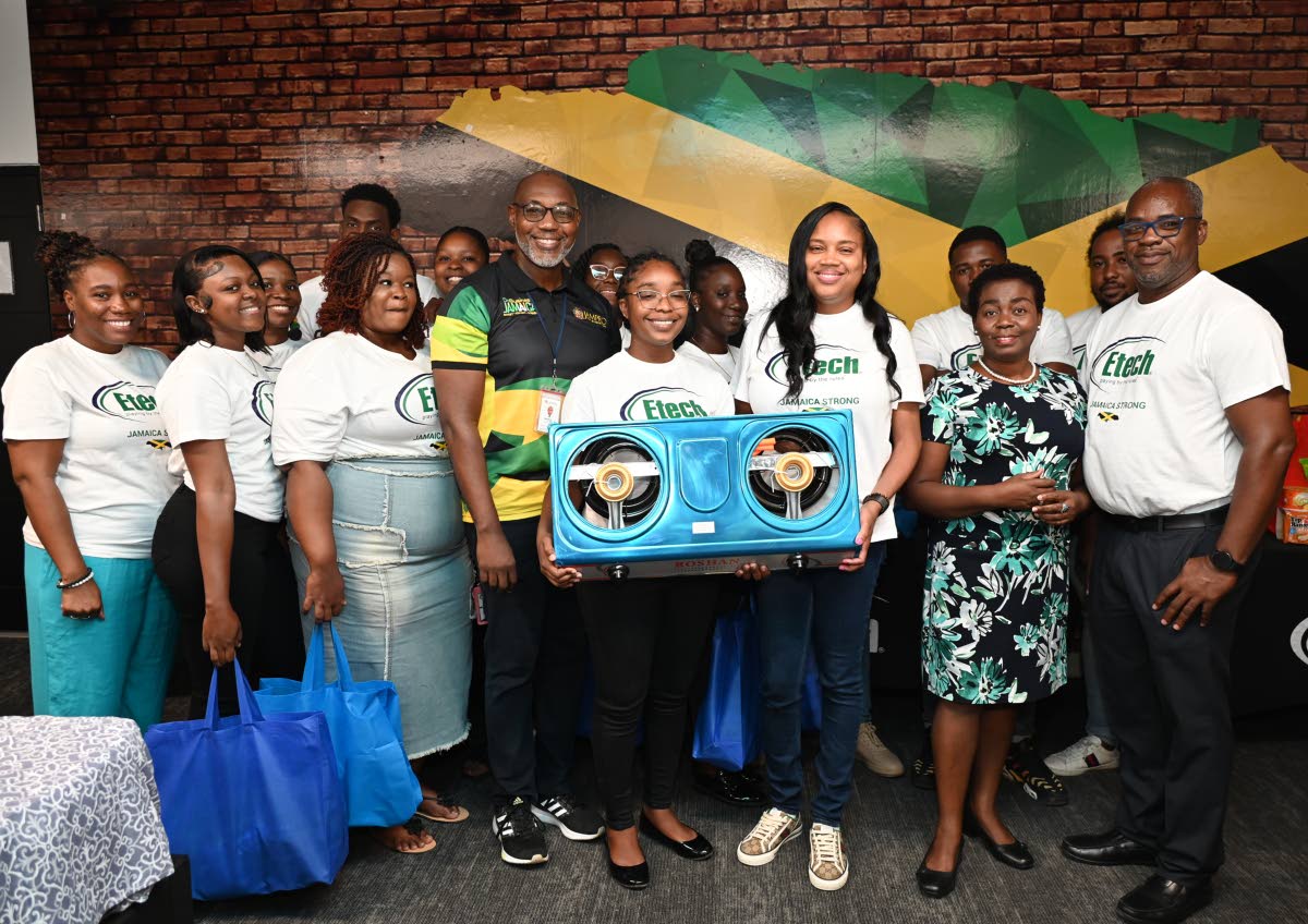 Conrad Robinson (fourth left), JAMPRO’s manager of the Western Regional Office; Kadian Tulloch (fourth right), employee Strobe Etech Communications; Yanique Troupe (third right), country manager, Strobe Etech Communications, Gloria Henry (second right), 