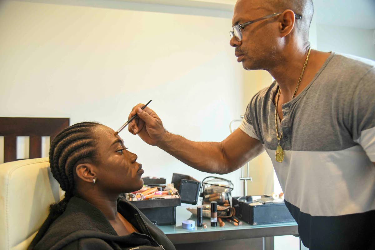 Make-up artist Paul March at work on SAINT model Shanice Thompson.