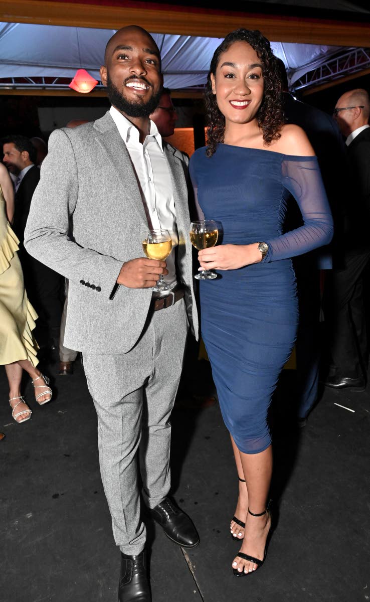 Joel Laing, Mandarin interpreter and business development manager, with Kellise Wong, group marketing manager of ATL Automotive, who turns heads in a navy one-shoulder bodycon midi and strappy sandals.