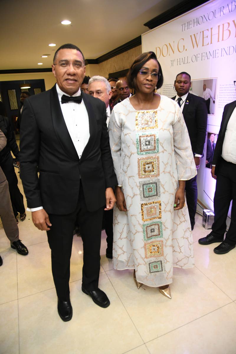 Prime Minister Andrew Holness and his wife, Speaker of the House of Representatives Juliet Holness, make their grand entrance.