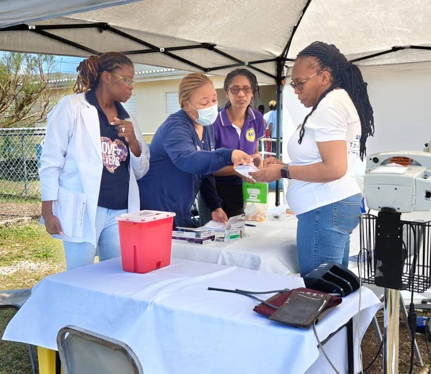 Dr Lisa Henry, director of Nursing Services, Andrews Memorial Hospital, guided the triage process at the Hurricane Relief Health Clinic with Fredricka Coombs and Charmaine Blythe, laboratory manager and assistant laboratory manager at AMH. Looking on from 