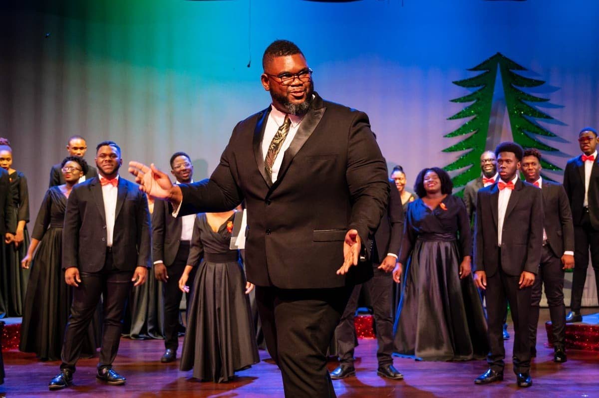 Gregory Simms, principal director and founder of the Jamaica Youth Chorale and The Kingston Seventeen,  interacts with audience members at last year's Christmas Joy concert. 
