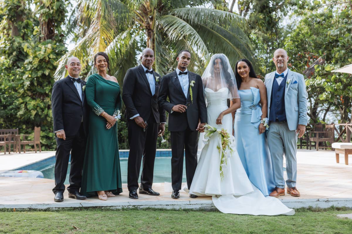 It really takes a village, and the newly-weds (centre) are forever grateful for their parents’ support. From left: the groom’s stepdad, Daren Bayley-Hay; mother Debbie Bayley-Hay; father Anthony Anderson; and the bride’s parents, Donna and John Levy.