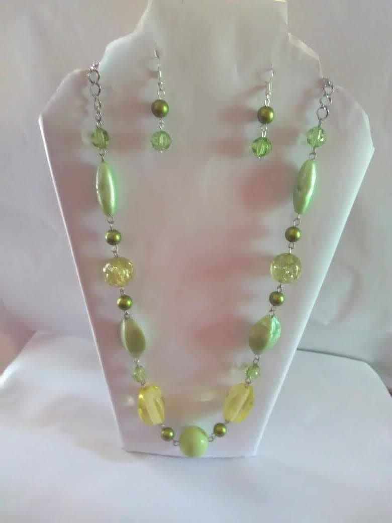 Jewellery set featuring necklace and earrings on show.