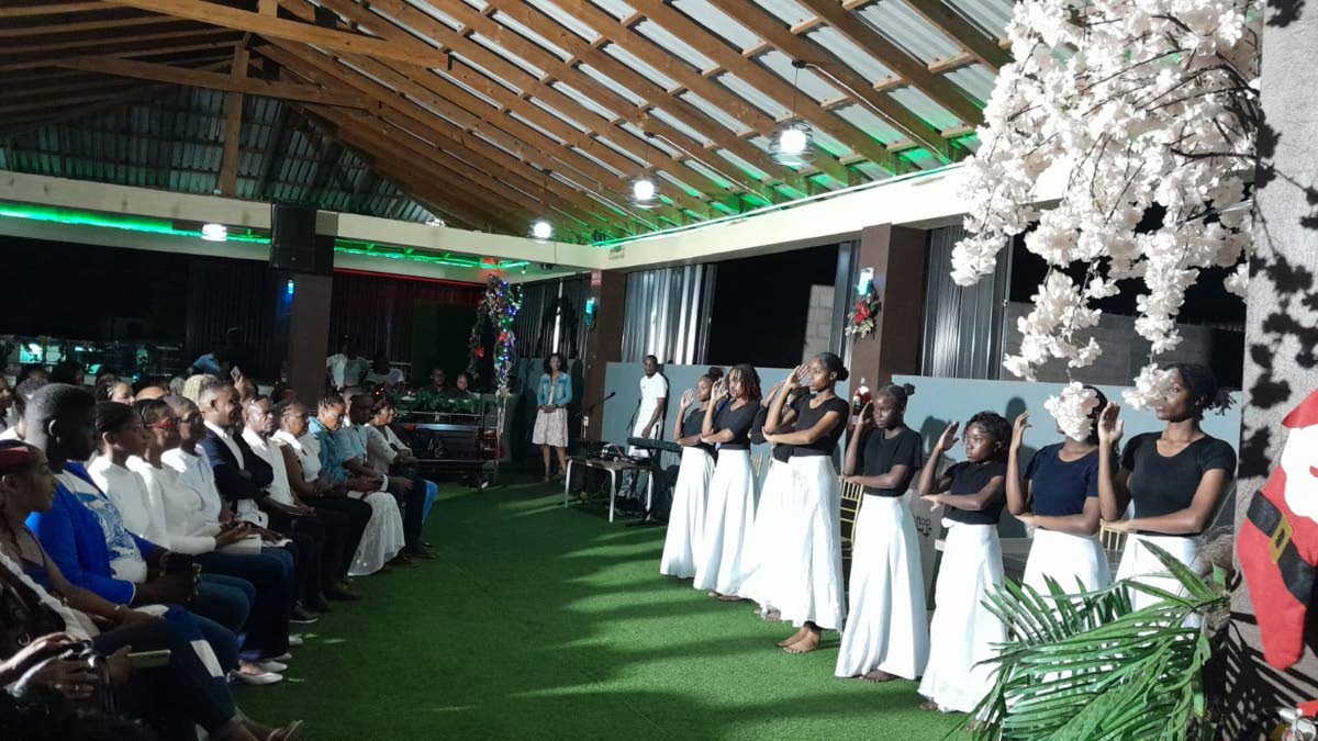 Students from the Old Harbour High School performing at the book launch.