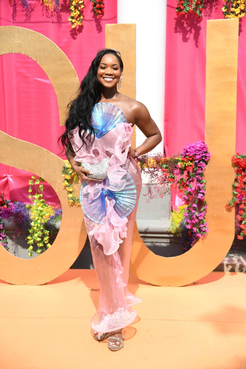 Centre: Chana-Lee Scott, governance, risk, and compliance analyst, keeps it classy and compliant in a flowing LFJ Official number.