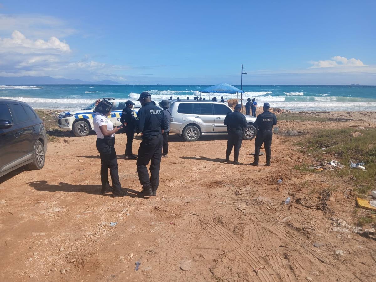
Members of the Marine Police and the Jamaica Defence Force searching for Constable Shamar Grant and 13-year-old Arron Russell, who were swept away by strong currents in Hellshire, St Catherine, on New Year’s Day.