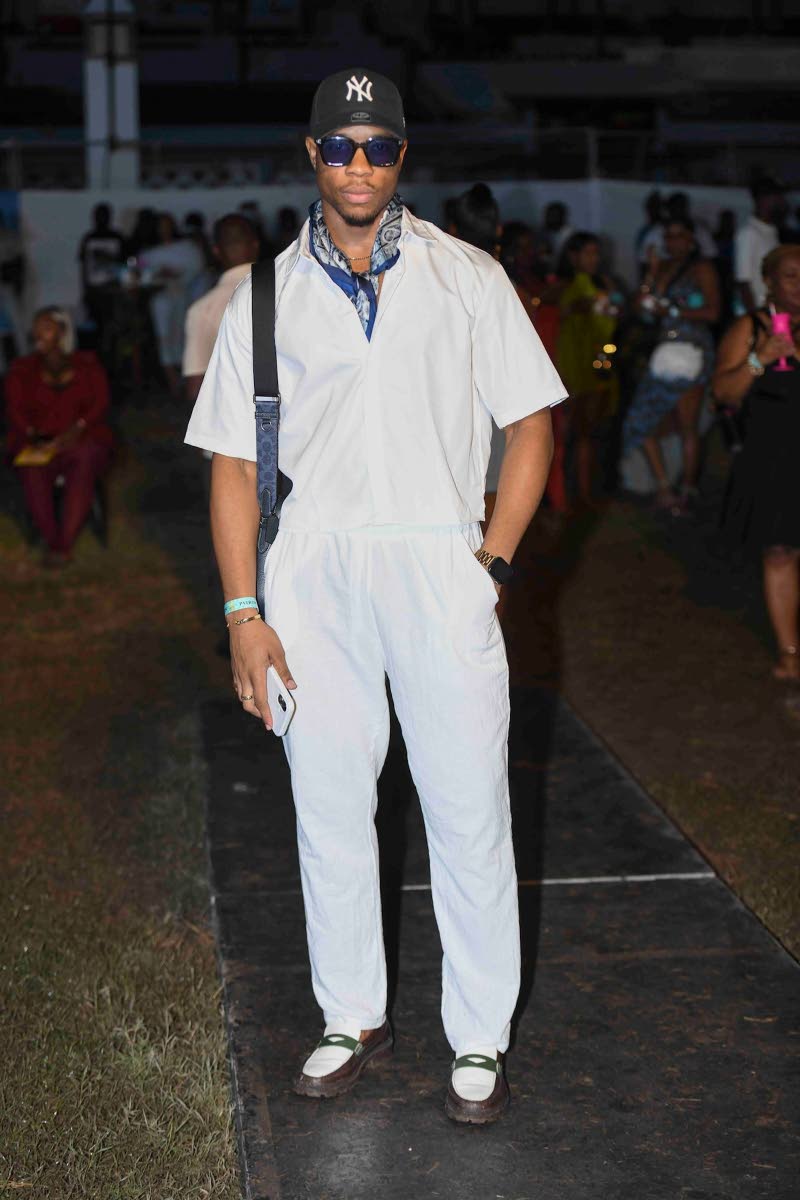 Above: Chadwick Williams was flexing in full white from NovaMEN, paired with considered accessories, including multicoloured loafers, a scarf, and a New York Yankees cap.