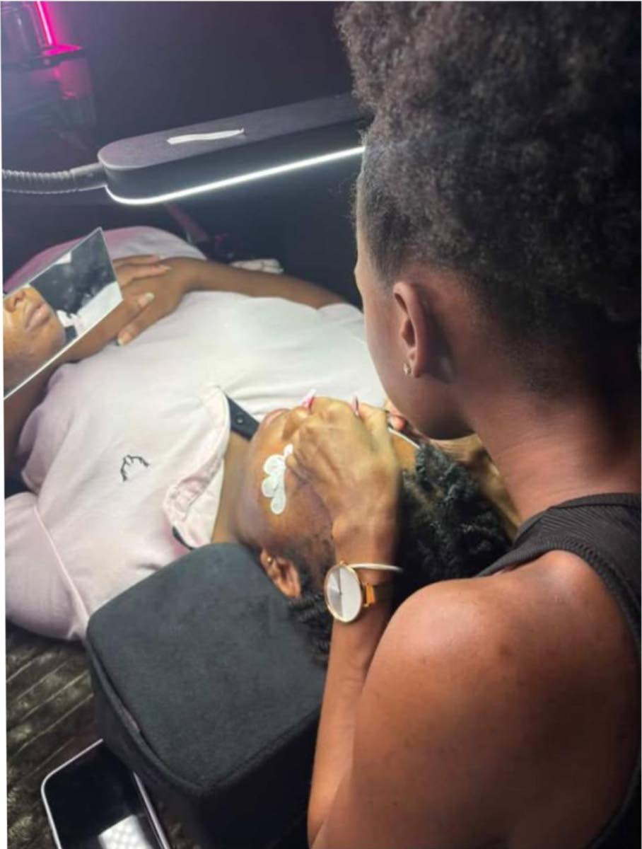 Kyra Mills applies cluster lashes, among the services offered at The Skin Lab Beauty Bar.