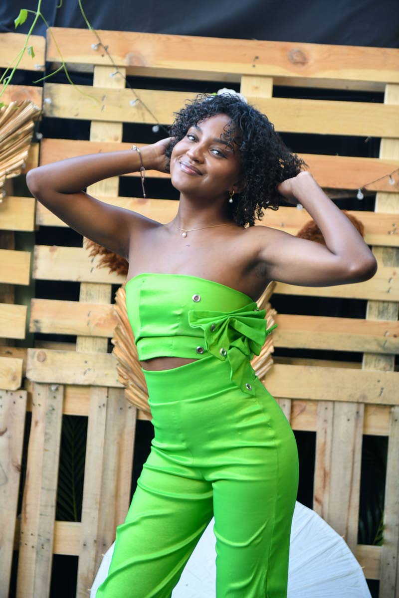 Fun meets flirty for this green jumpsuit with cutout details, sported by the lovely Lianne Fullwood.