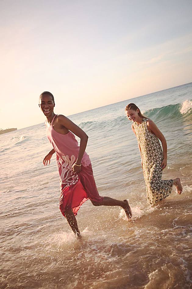 Shot in the lapping surf of the Dominican Republic, The Rock’s Tami Williams (left) wears the pink embroidered coral Millay dress from Tuckernuck’s Resort 2026 collection. Her American model peer Paige Reifler is in a fern lace crochet Leilana dres