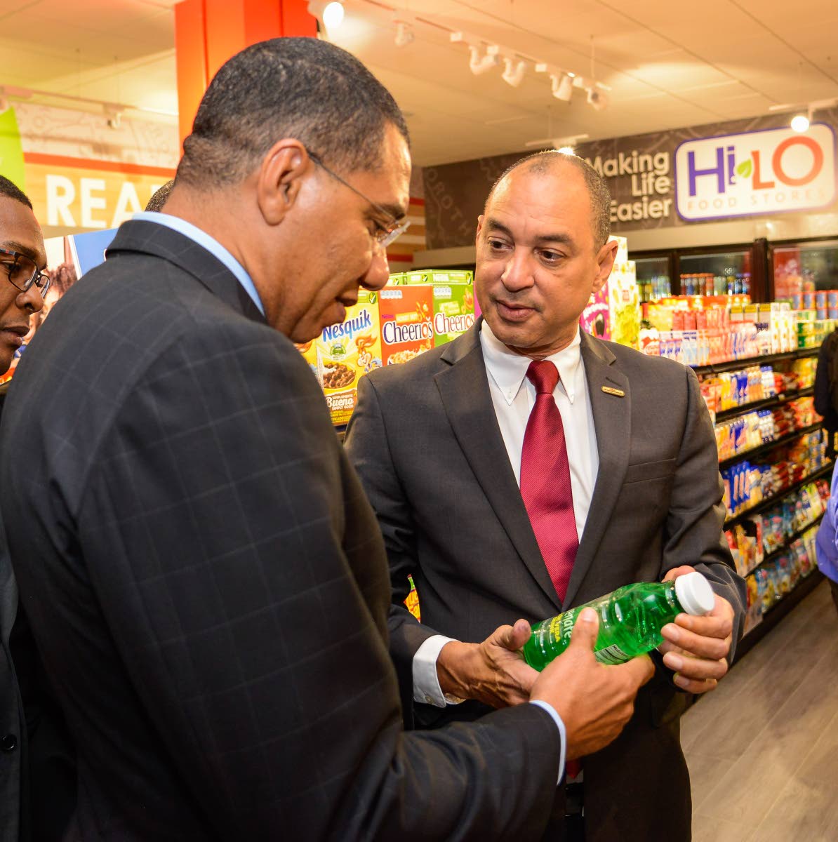Prime Minister Dr Andrew Holness is introduced to a product by GraceKenedy CEO Don Wehby during a tour of the Hi Lo Express Food Store located at GraceKenndy headquarters in downtown Kingston in 2019.