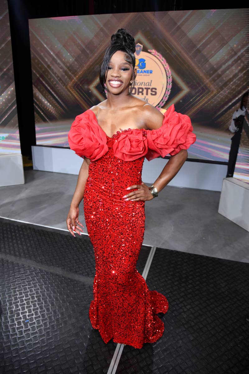 Winning on the track and the red carpet, 100m World Championships silver medallist, Tina Clayton dazzled in red radiance wearing Kadian Nicely  Exclusive couture when she was awarded the sportswoman of the year. 