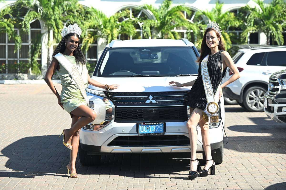 Miss Global Jamaica 2025 Keri-Ann Greenwood (left) and Miss Global 2025 Nguyễn Đình Như Vân poses next to the 2026 Mitsubishi Outlander