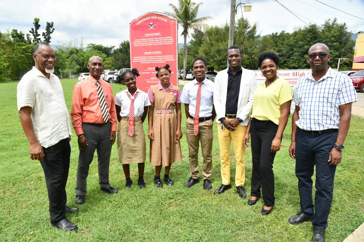 Principal Charlemont High School, Garth Gayle (second left), and Vice Principal, Valdin Legister (third right), with students and other leaders at the school.