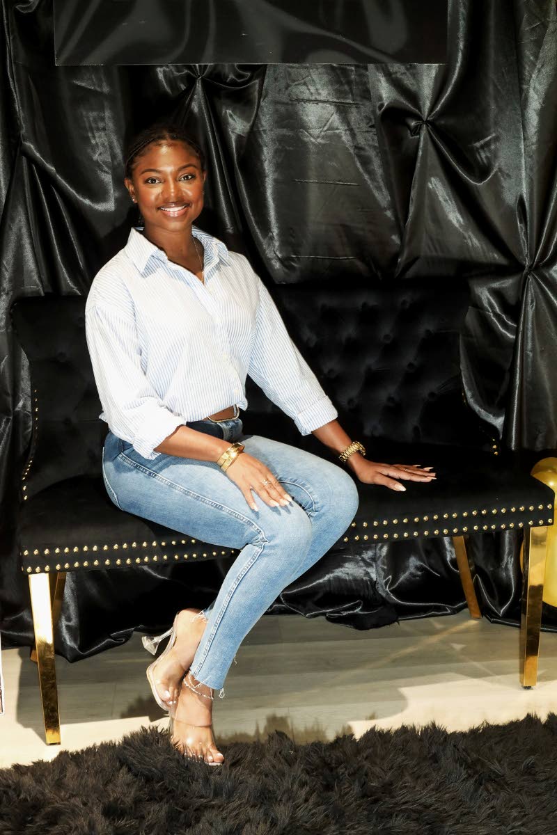  Shanique Goodwill rocks a button-down shirt with denim and heels.