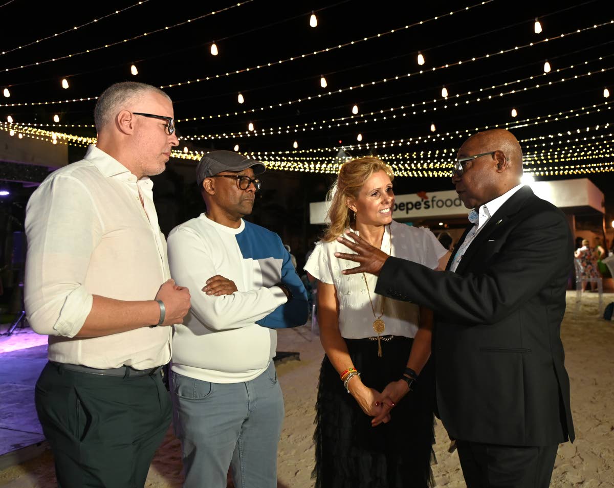 From left: Philip Rose, deputy director of tourism; Donovan White, director of tourism; Jackie Marks, global head of trade brands, Apple Leisure Group Vacations; and Tourism Minister Edmund Bartlett in conversation during a special welcome dinner for Apple