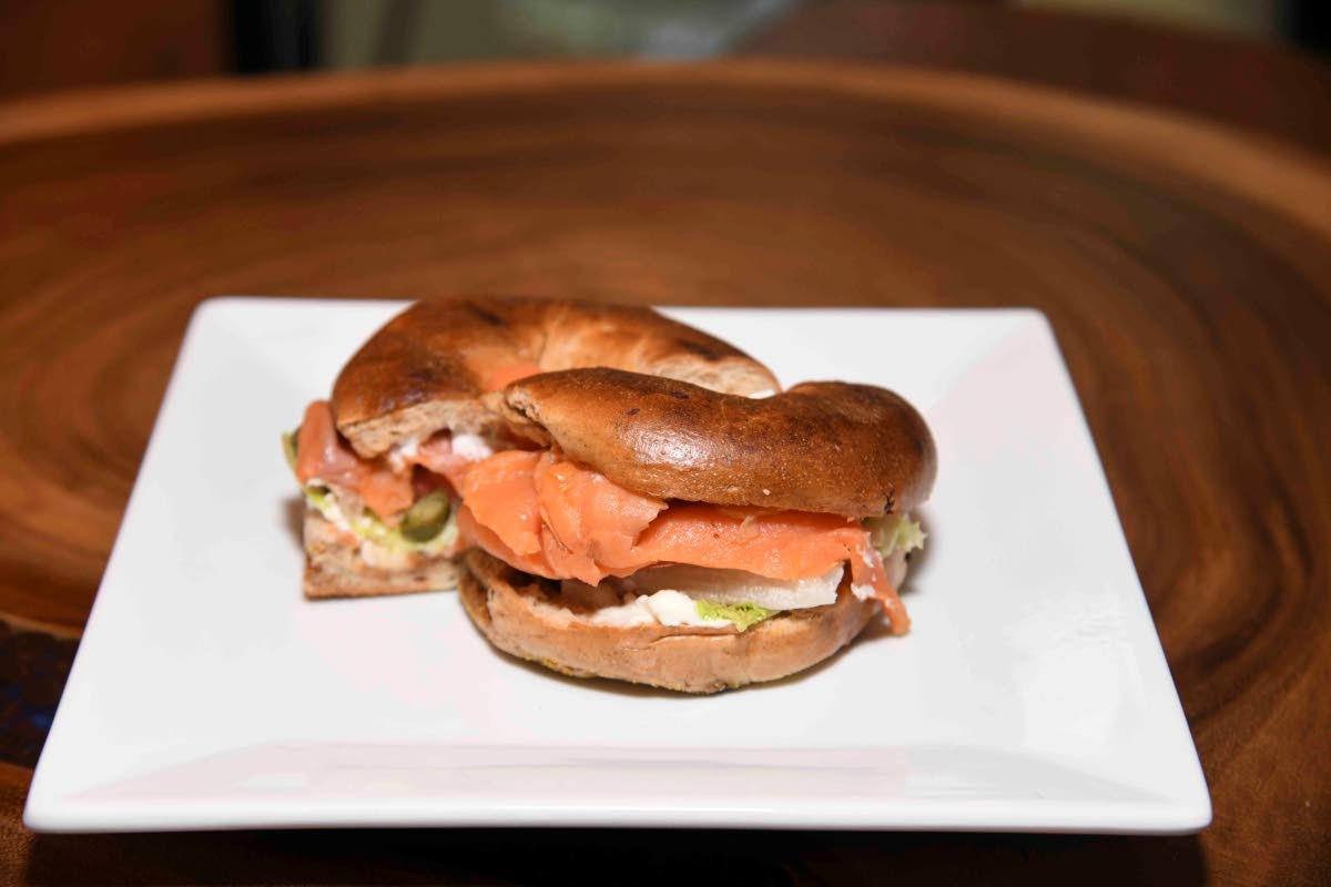 Serving breakfast all-day long, Cafe Blue invites you to try this mouthwatering salmon bagel.