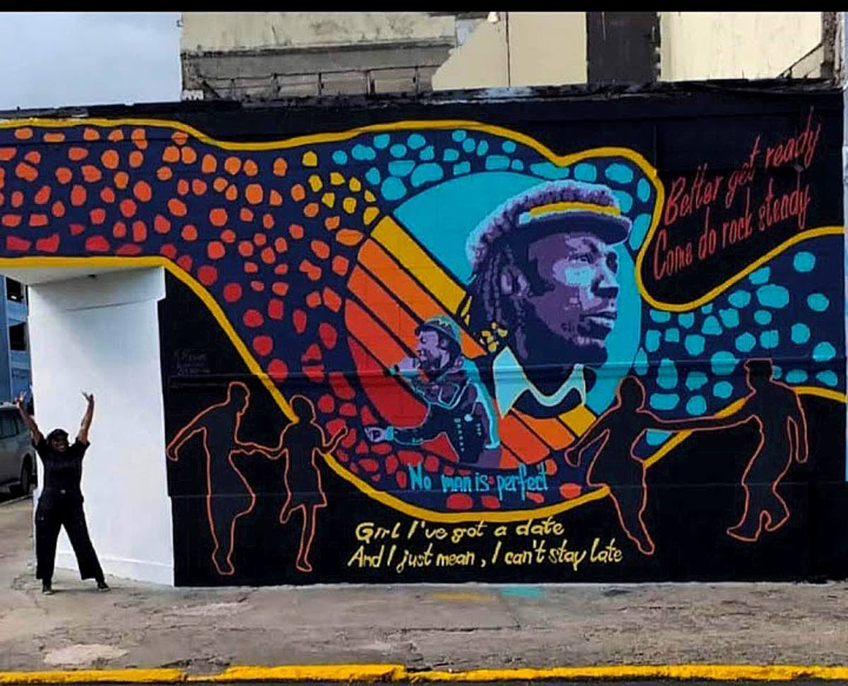 Rowe stands proudly beside her masterpiece which honours reggae sensation Alton Ellis and even quotes the iconic lines of his 1967 hit song, ‘Girl I’ve Got A Date’. 