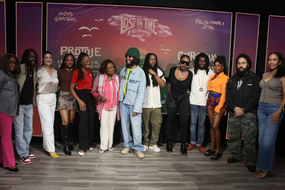 Some of the artistes who will be performing at the Lost in Time Festival on February 28 and March 1 get their photo ops with Entertainment Minister Olivia Grange (sixth from left) and sponsors during the launch on Thursday at the AC Hotel Kingston.