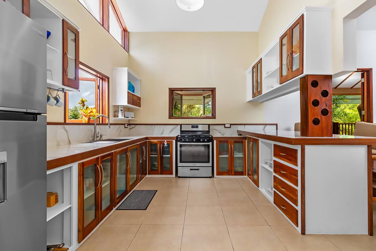 An eye-opening, see-through kitchen with glass-front doors on both upper and lower cabinets.