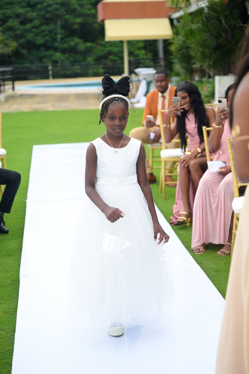 Savannah Rowe, Antoinette and Gareth’s daughter, was all sweetness as the flower girl.