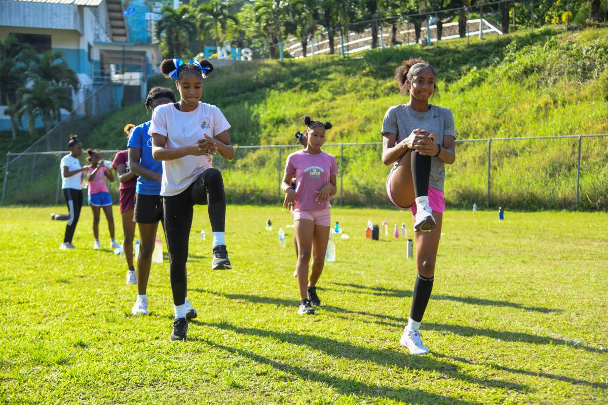 Kerelle Etienne (left) and Andriana Pine lead an Edwin Allen High School training session last month. 