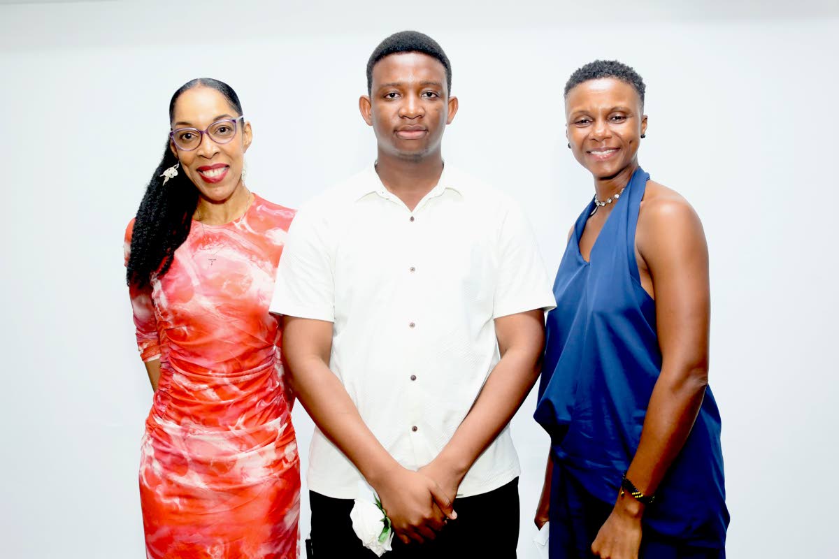 Jamar Grant (centre), winner of the What’s Your Story, Jamaica? Storytelling Competition for ‘In Search of More-Rock’, is joined by second-place finisher C Shaw-Reid (left) with ‘A Blessing and a Curse’, and third-place finisher Tanisha Bent with