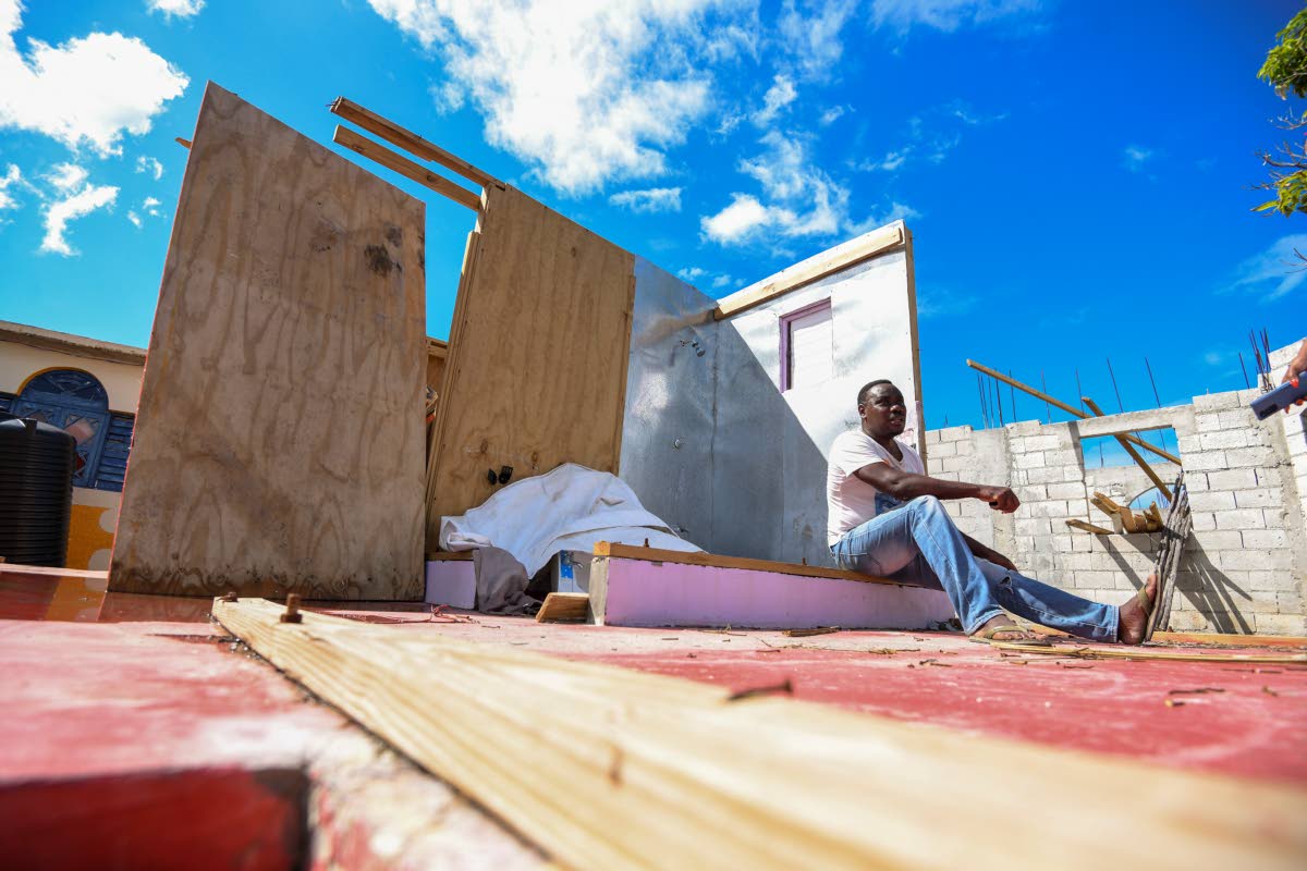 Owen Smith, a resident of Parrottee in St Elizabeth, sits among the downed plyboards of his home destroyed by Hurricane Melissa, while still reeling from losses caused by Hurricane Beryl in 2024. 