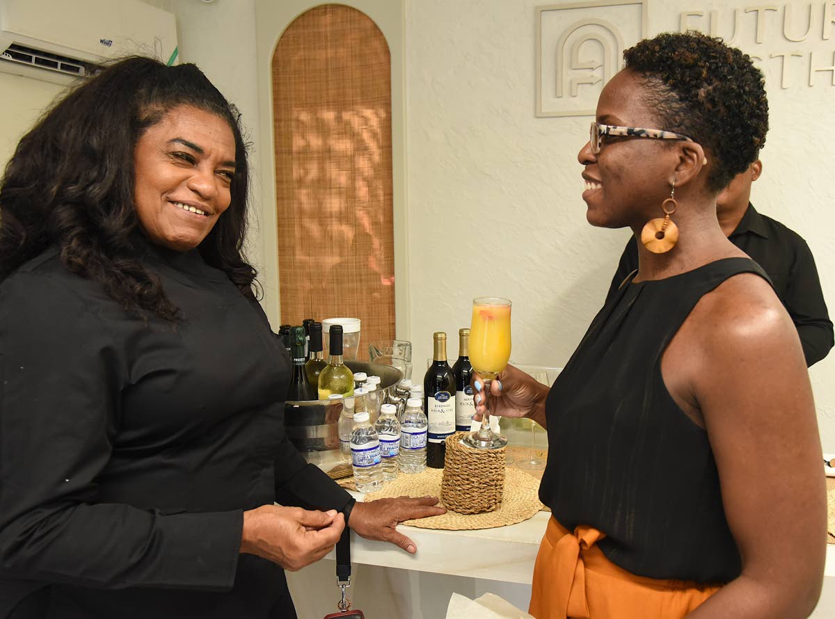 Chef Jacqui Tyson (left) shares a lively moment with Jahmai Mesquita.
