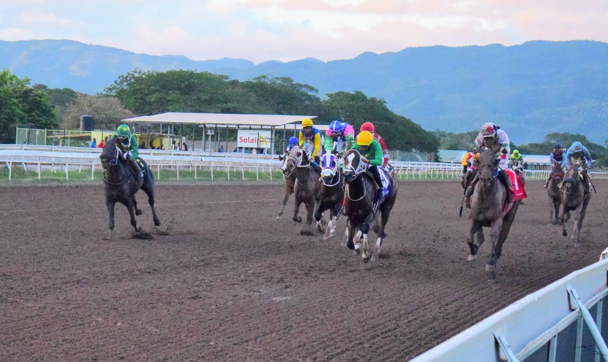 
WHIZZ KIDD (right), ridden by Robert Halledeen, wins the seven-furlong nightpan ahead of RANI BANGALA (Tevin Foster) at long odds 67-1 at Caymanas Park yesterday.