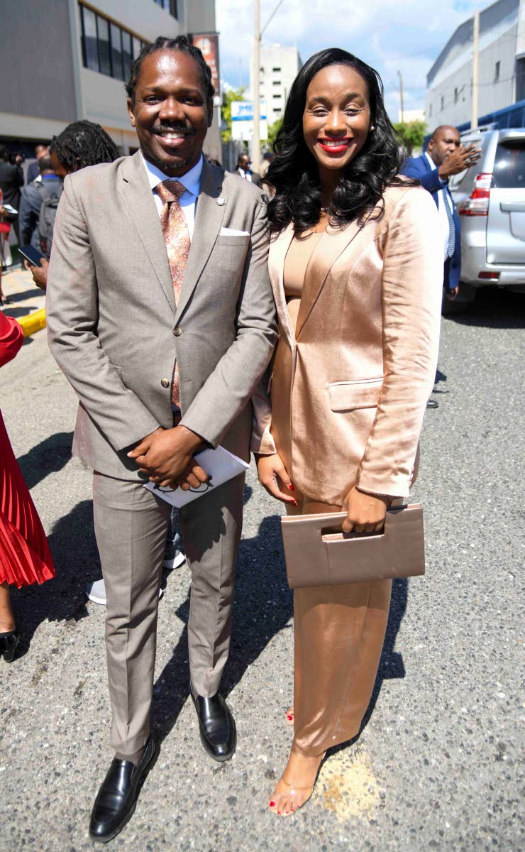 They might be on opposing sides, but they bear the same last name. Member of Parliament for St Catherine North Western Damion Crawford is all smiles alongside Member of Parliament for Manchester Central Rhoda Moy Crawford.
