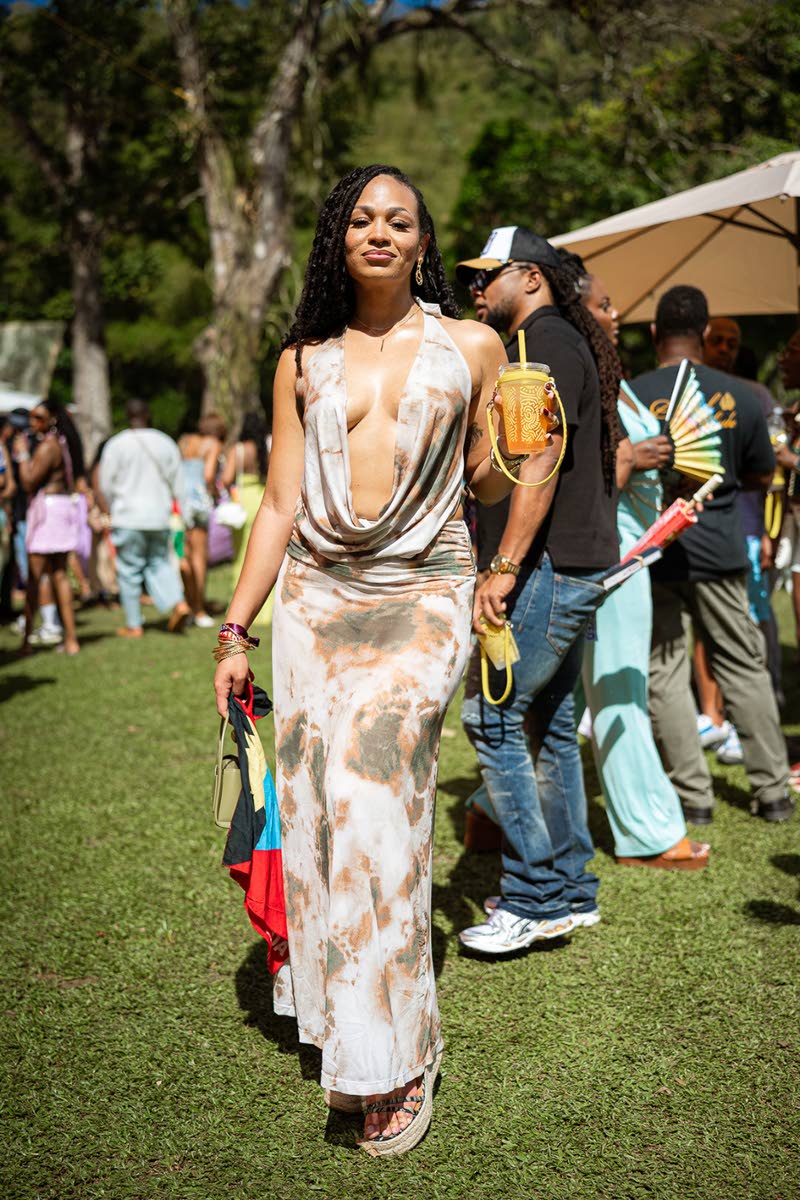 Camaira Lynch, manager of business operations, stepped out in a low-cut dress from Shein, posing with the Antiguan flag in hand to represent her island.