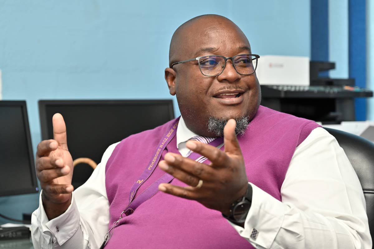 Reverend Claude Ellis, principal of the St Andrew-based Pembroke Hall High School.