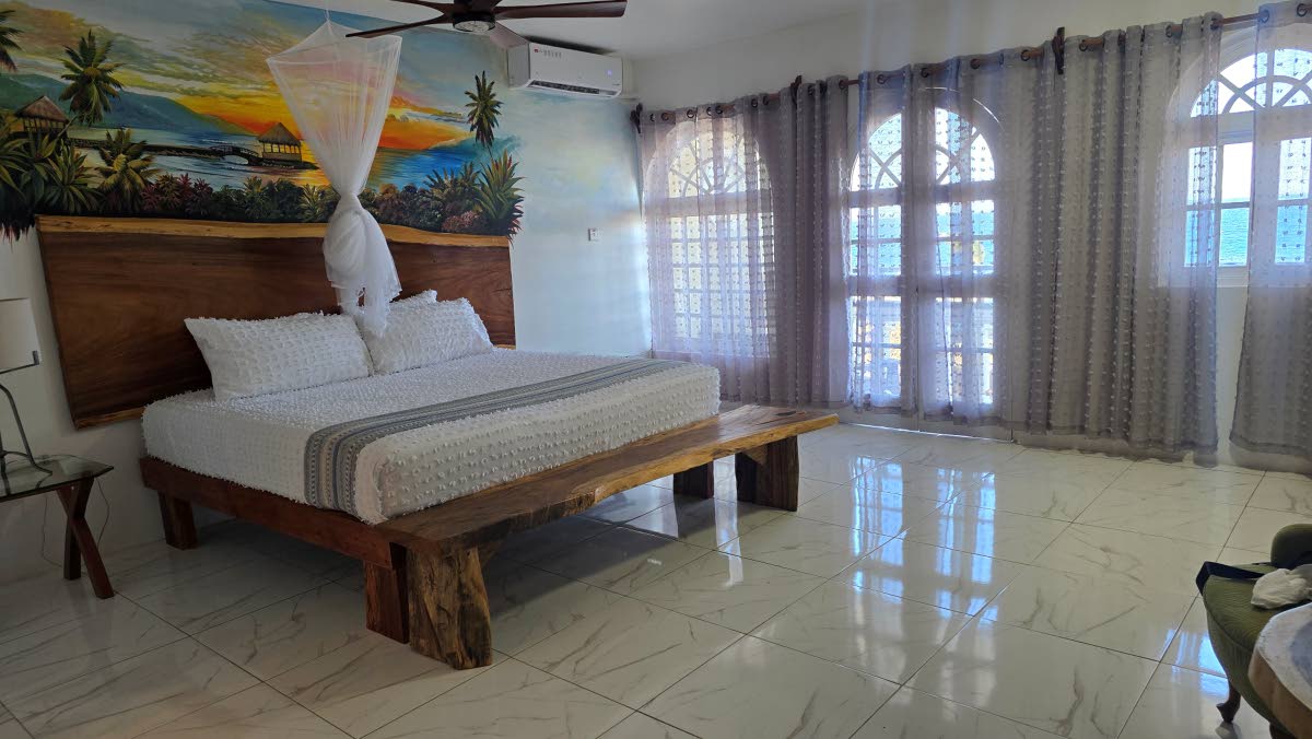 A spacious bedroom at the Tiamo Beach Resort and Spa.