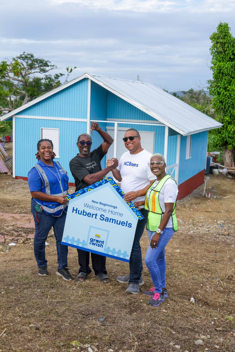 Hubert Samuels celebrates receiving the keys to his rebuilt home, ending months of separation from his wife, daughter and granddaughter following the devastation caused by Hurricane Melissa.