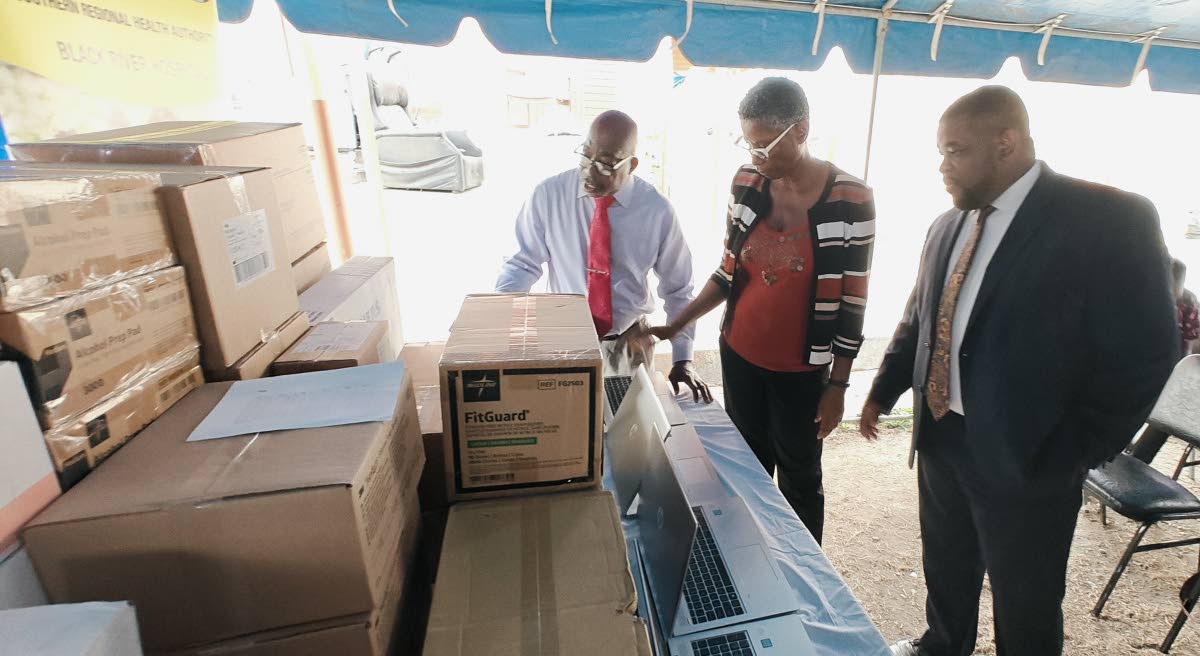Pastor Charles Brevitt (left), who represented newly elected Jamaica Union Conference President Pastor Glen Samuels, joins Donmayne Gyles, president and chief executive officer of Andrews Memorial Hospital Limited, and Black River Hospital Chief Executive 