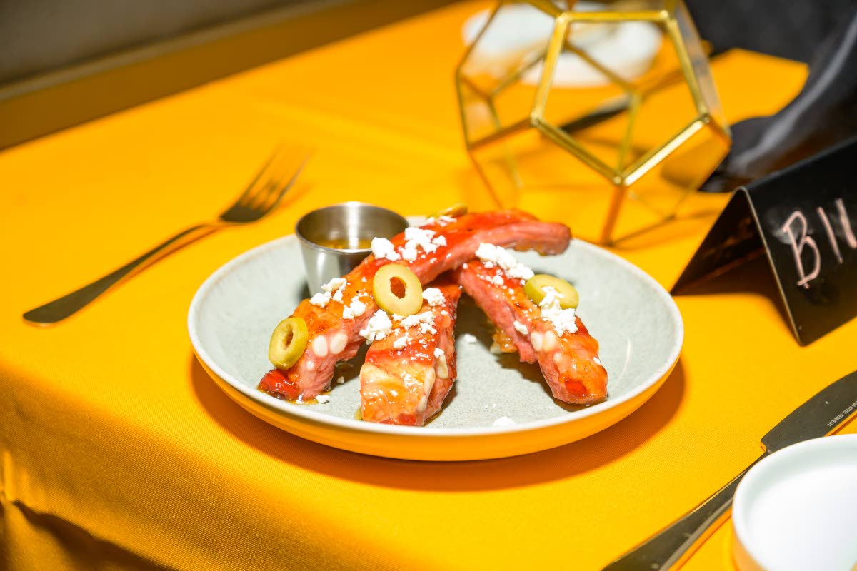 The maple sticky spare ribs arrived glazed and tender, topped with crumbled feta and finished with ginger scallion.