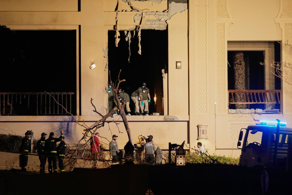 Firemen and rescue workers inspect the site of an explosion at the Fairmont The Palm Hotel in Dubai, United Arab Emirates.