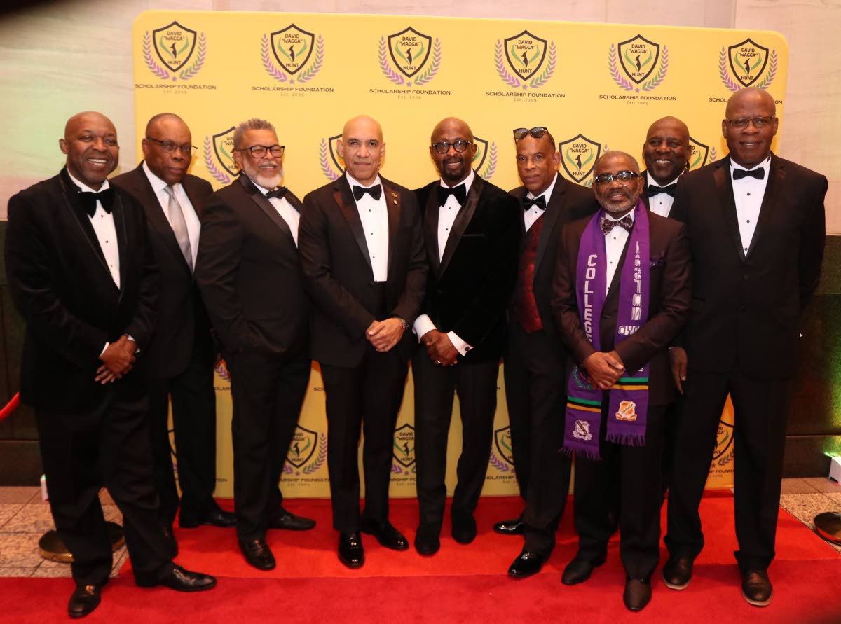 Jamaica’s Ambassador to the United States, Major General (Ret’d) Antony Anderson (centre) shares the spotlight with members of the David ‘Wagga Hunt’ Gala organising committee at its 12th annual red carpet gala at the National Education Association