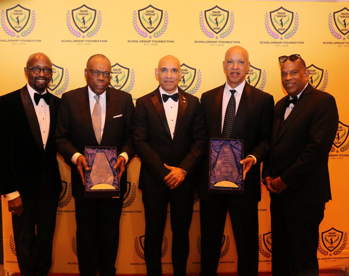 Jamaica’s Ambassador to the United States, Major General (Ret’d) Antony Anderson (centre) with 2026 David ‘Wagga’ Hunt Foundation awardees George Wille (second left) and Wayne Hewett (second right) after they received their awards at the 12th annua