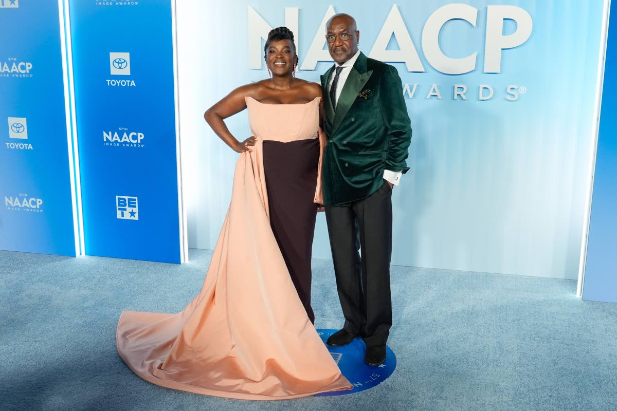 ‘Sinners’ co-stars Wunmi Mosaku (left) and Delroy Lindo arrive on the blue carpet, with Mosaku wearing Christian Siriano.