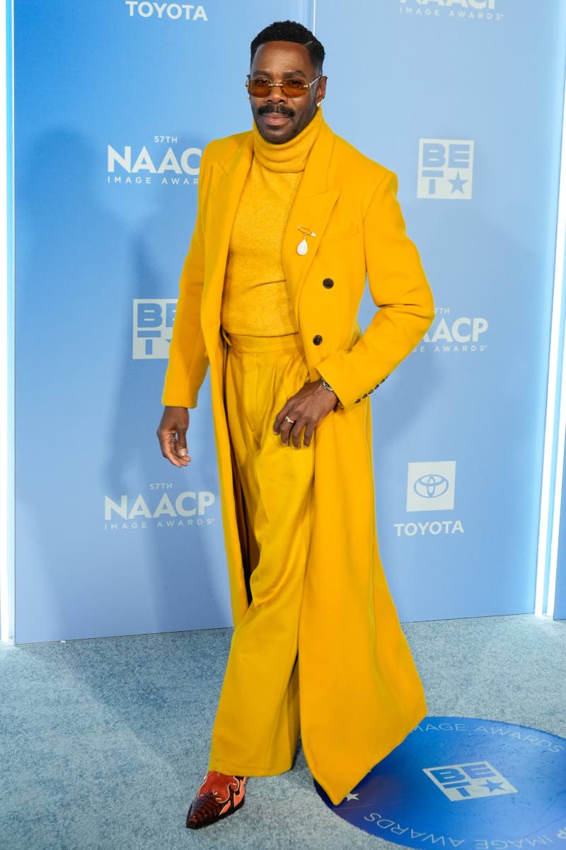 Colman Domingo wore mustard Sergio Hudson – a trench, polo neck shirt and tailored trousers.