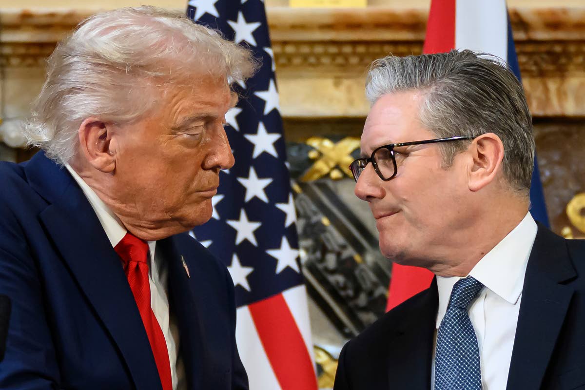 US President Donald Trump, left, and British Prime Minister Keir Starmer look at each other as they shake hands during a press conference at Chequers near Aylesbury, England on September 18, 2025. Leon Neal/Pool Photo via AP, File)
