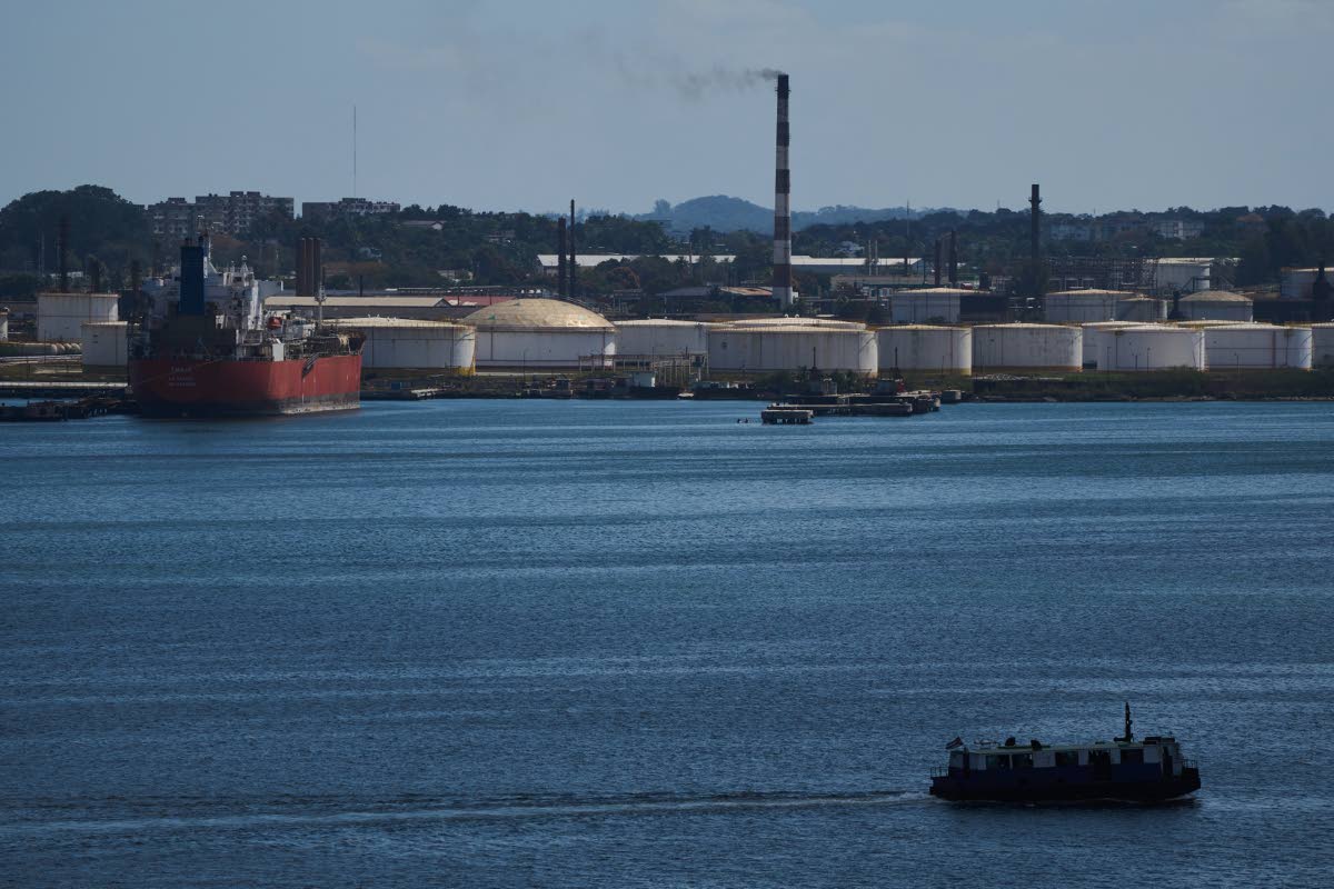 A ferry crosses Havana Bay past the Nico Lopez oil refinery where a Cuban tanker is anchored in Havana, Cuba, Thursday, February 26, 2026. 