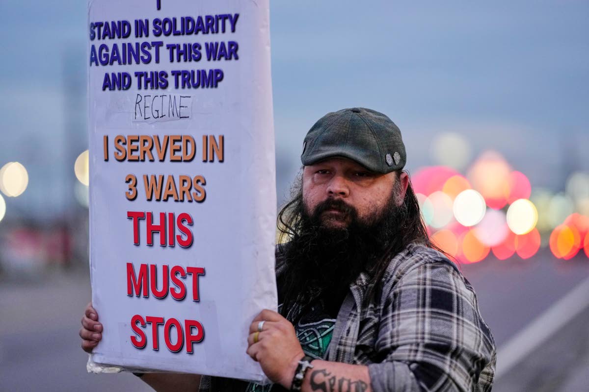 Army veteran Christopher William McFarland protests the war in Iran on Monday, March 2, 2026, in Clarksville, Tenn. 