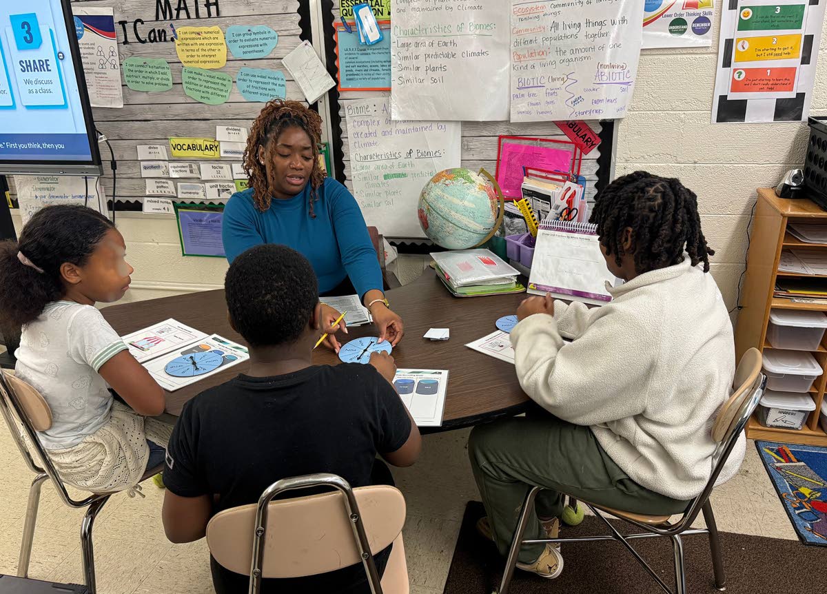 Kay‑Ann Bartley works with a small group of grade five students in Cumberland County, North Carolina.