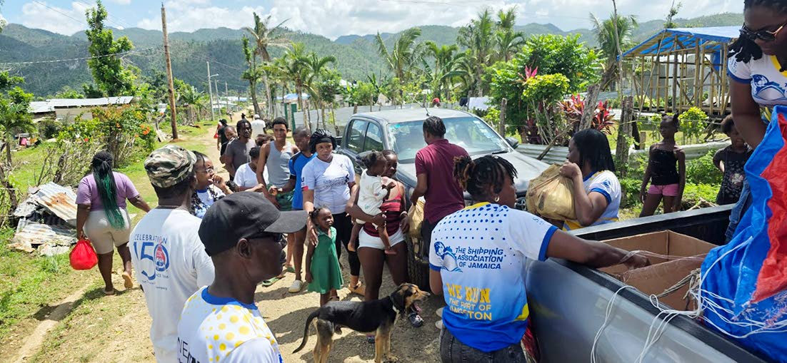 Members of the Shipping Association’s team distributing relief packages to residents in Goldsmith, Westmoreland.
